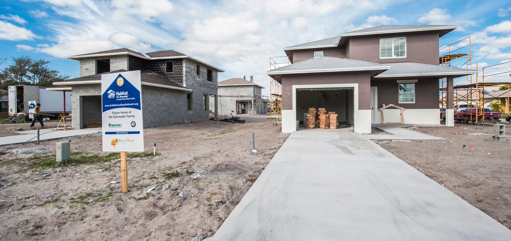 two story, one car garage house in the middle of construction