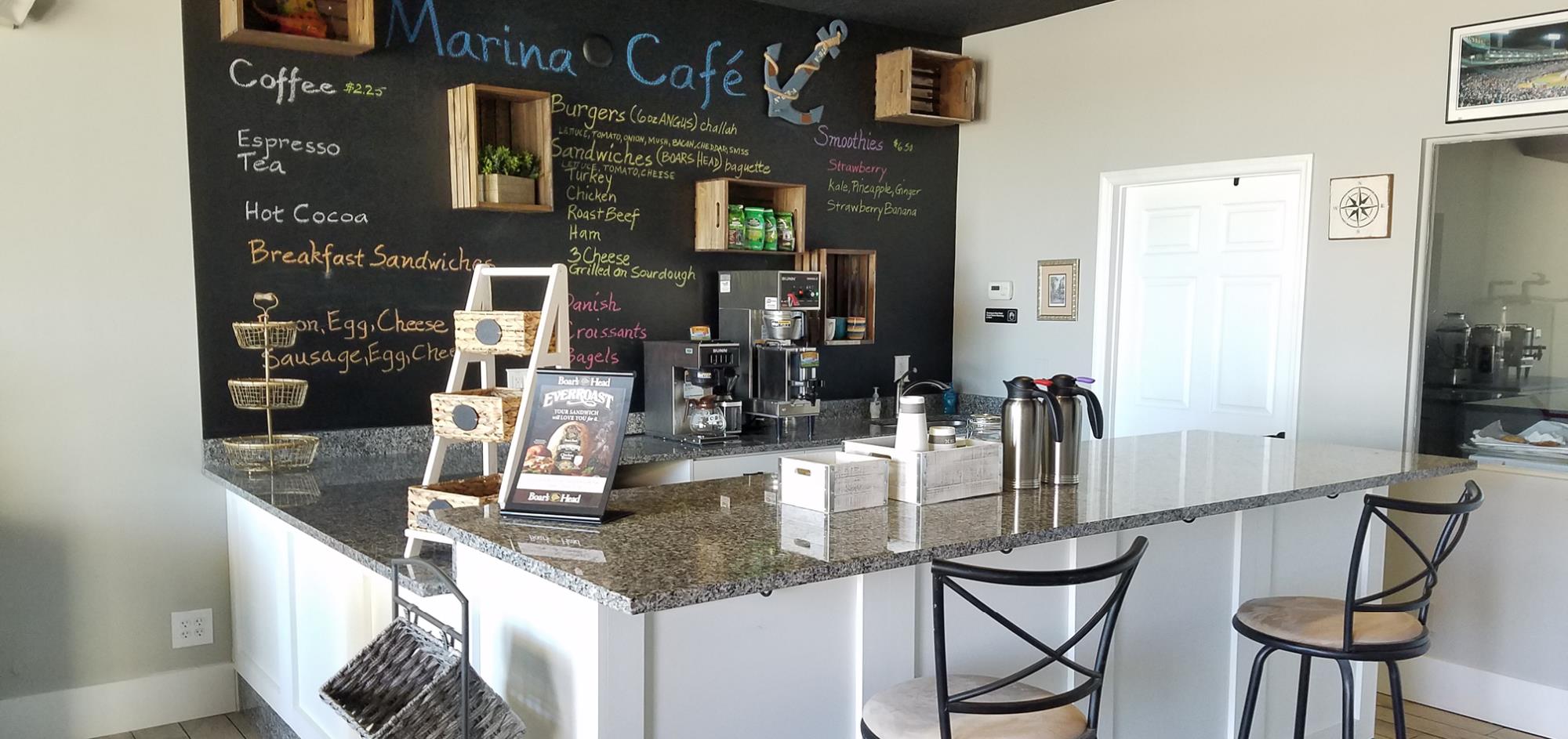 Interior photo at Marina Cafe showing front counter and chalkboard menu