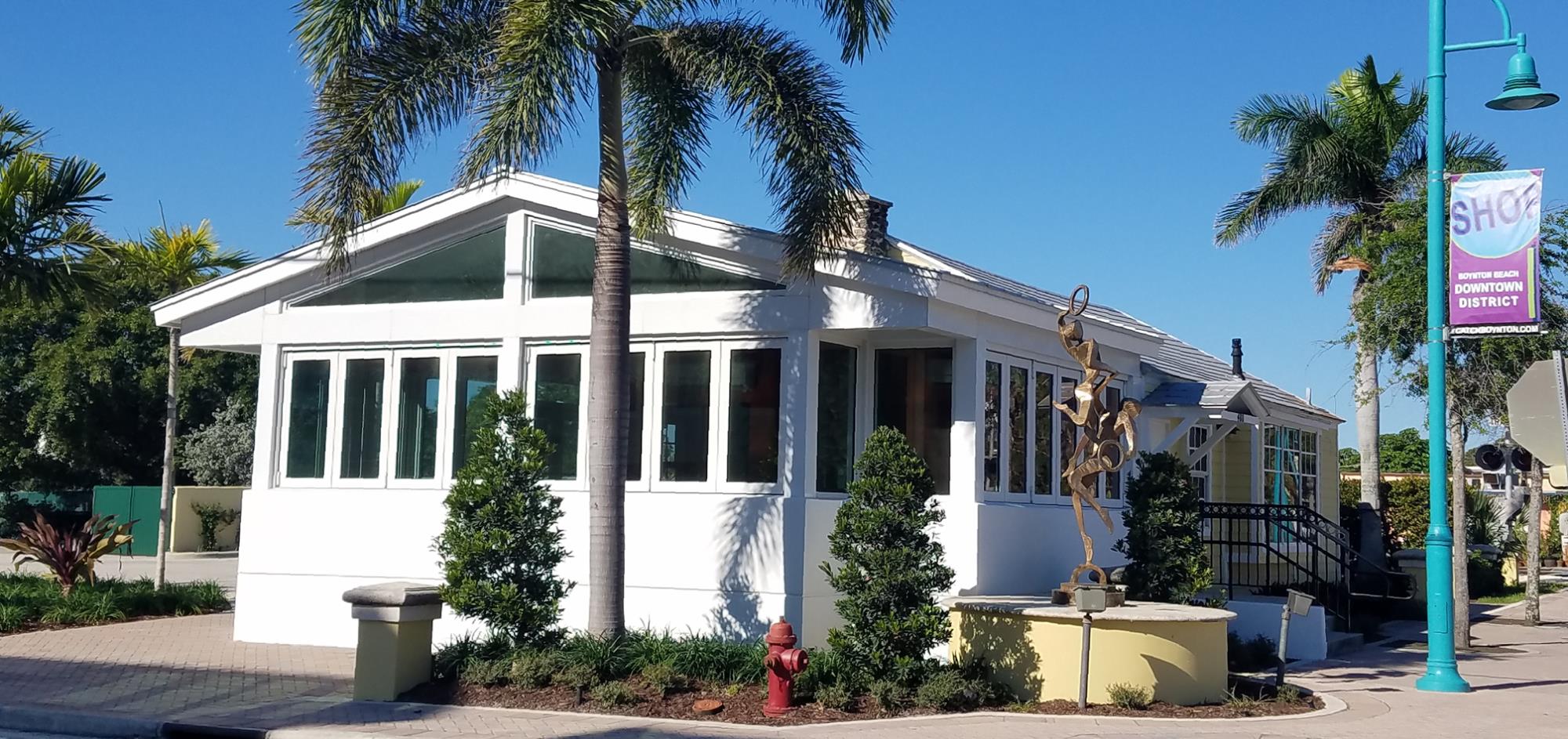 Exterior view of Chez Andrea's Restaurant - white façade with wrap around windows