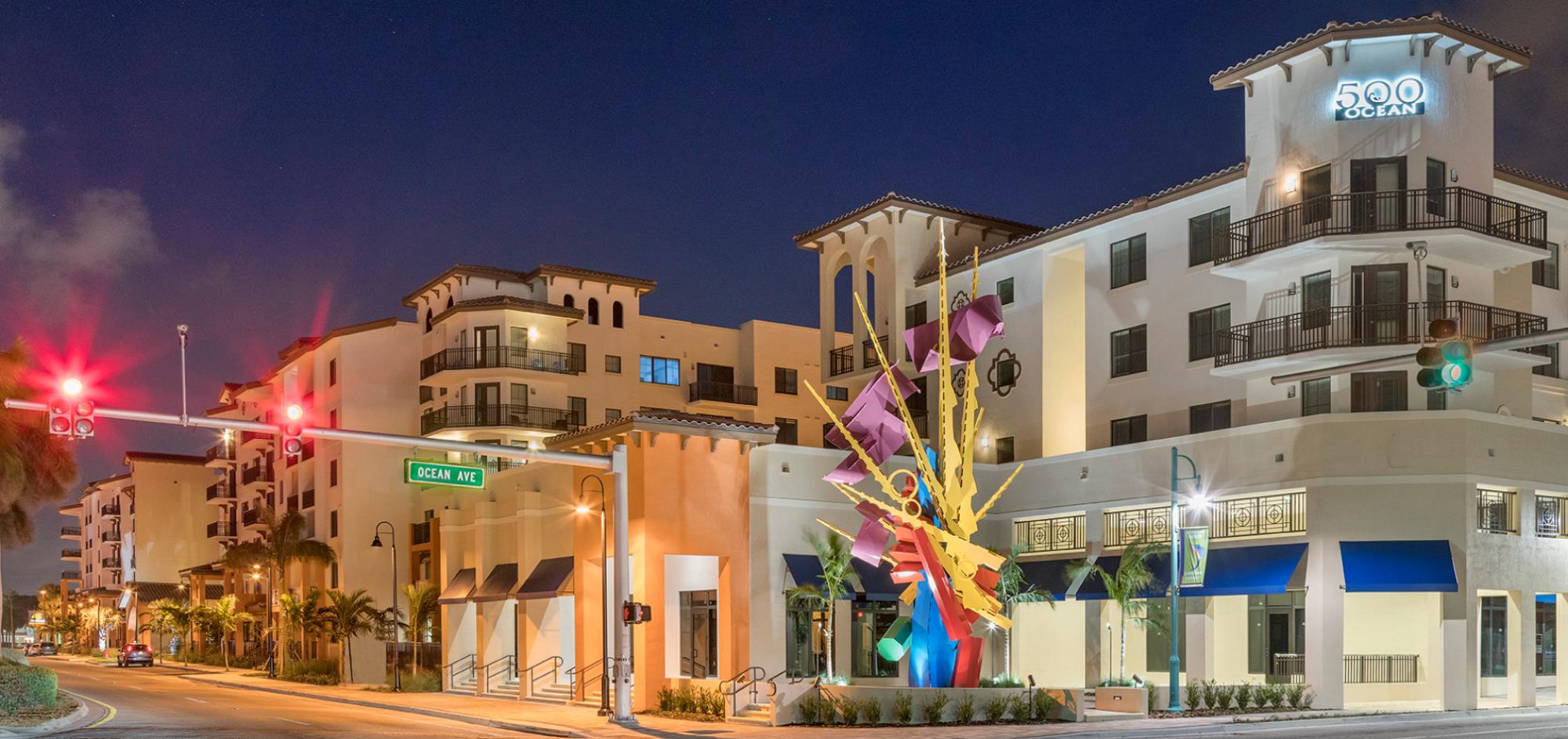 Night view of 500 Ocean Building with Art Sculpture in fron